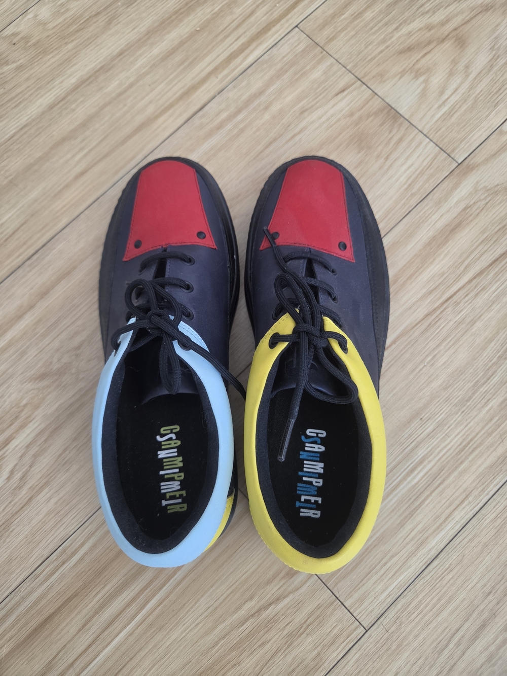Camper Women’s Moccasins in Black with Red Toe, Yellow & Light Blue Collars